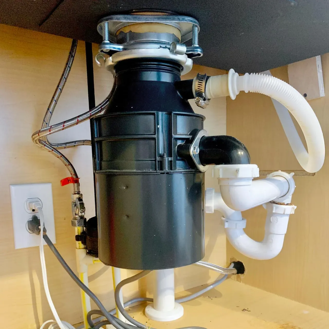 Garbage disposal and kitchen sink plumbing serviced by Allegiant Plumbing